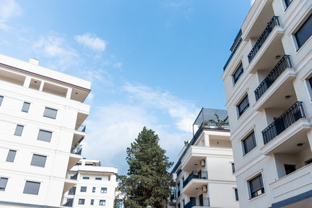 Multi storey residential building in suburb of the city, a house against the background of a sunny...