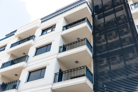 Multi storey residential building in suburb of the city, a house against the background of a sunny...