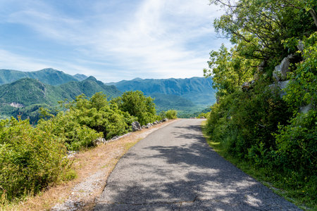 Scenic road among the mountains of Montenegro, the car is driving along a country road highwayの写真素材