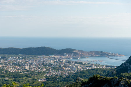 View of the panorama of the city of Bar and the Adriatic Sea in Montenegro from the height of the mountainsの写真素材