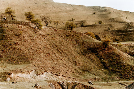 Landscape of Dagestan mountains, mountain range in haze in summer Russia