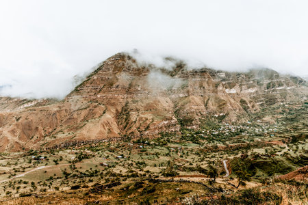 Landscape of Dagestan mountains, mountain range in haze in summer Russiaの写真素材