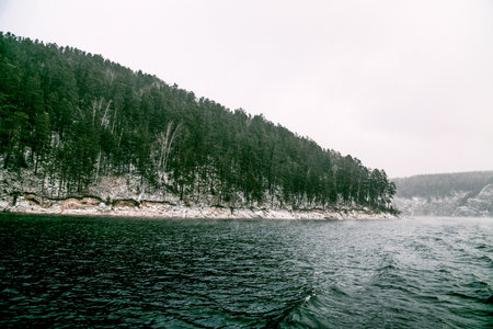 Krasnoyarsk Reservoir on the Yeniisei River, winter landscape on cloudy day in Siberia