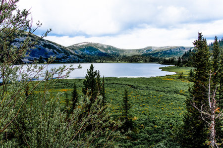 High-altitude lake in Ergaki National Park in Siberia, Russia, summer landscape on sunny day