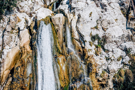 Picturesque waterfall cascade with a powerful flow of water, a landscape of nature in national park...