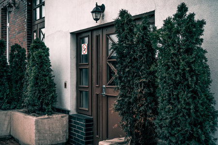 Entrance door to residential small city house in the neighborhood, exterior of building outside...