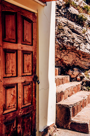Entrance door to residential small city house in the neighborhood, exterior of building outside...
