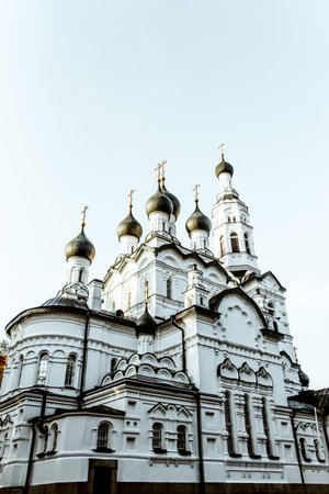 Orthodox cathedral kirk temple church with golden domes and crosses, exterior outside