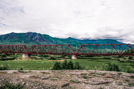 Railway bridge for the transport of trains across the small river in Siberia, Russia