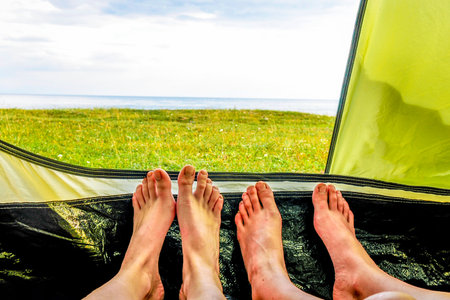 Nature view from tent, camping outdoor vacation adventure travelの写真素材