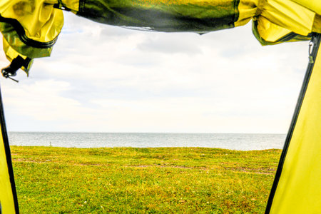 Nature view from tent, camping outdoor vacation adventure travelの写真素材