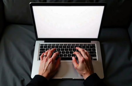 AI Generative Human Worker Work on Laptop at Desk in Office, remote work on notebookの素材