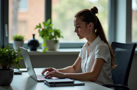 AI Generative Woman Worker Work on Laptop at Desk in Office, remote work on notebookの素材