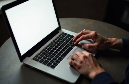 AI Generative Human Worker Work on Laptop at Desk in Office, remote work on notebookの素材