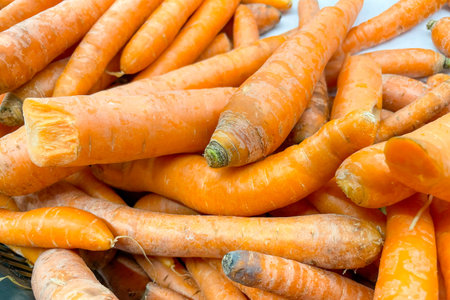 Carrots in basket at the grocery store, fruits and vegetables are sold at the market