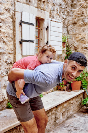 Dad and daughter family fooling around, man and cute little toddler girlの写真素材