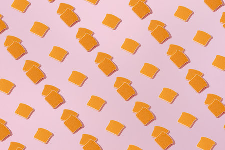 Creative pattern with slices of toast bread flat lay on pastel pink background minimalism conceptの写真素材