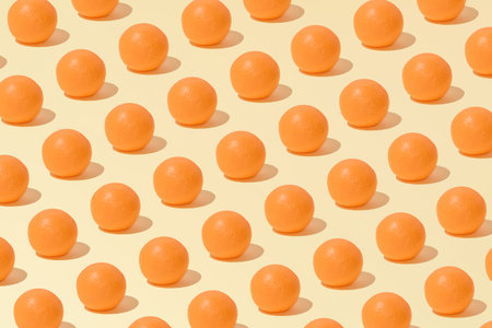 Creative abstract summer orange pattern flat lay on pastel yellow background minimalism