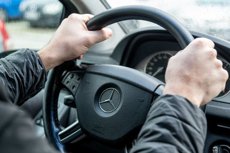 Bar, Montenegro, 9 January 2026, Man driver holding the steering wheel of Mercedes carのeditorial素材
