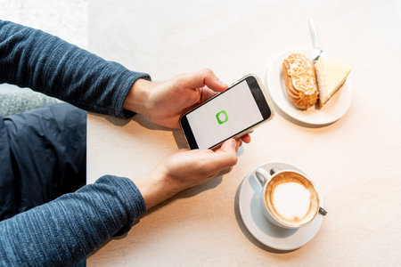 Bar, Montenegro, 9 January 2026, Man calls or writes message through modern iMessage mobile...