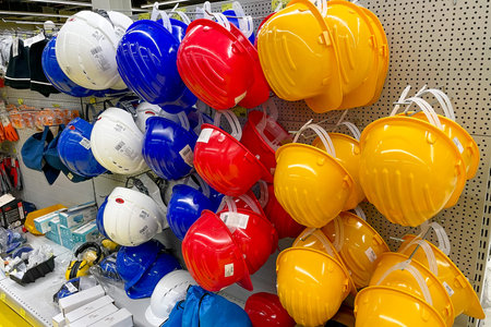Bar, Montenegro, 25 July 2025, Construction repair helmets sold in hardware storeのeditorial素材