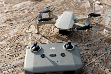 Bar, Montenegro, 2 November 2025, Drone UAV model DJI Mavic Mini and remote controller top view,...