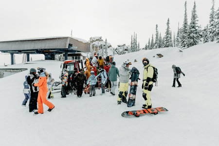 Sheregesh, Russia, 4 January 2021, Snowboarder skier getting out of snowcat on snowy mountain ski resortのeditorial素材