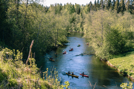 Karelia, Russia, 30 May 2020, Tourists sail on pond Lake Ladoga in canoe kayak boatのeditorial素材