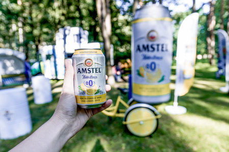 Moscow, Russia, 7 July 2019, Person is holding can of Amstel non-alcoholic beer in hand