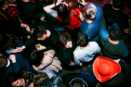 Saint Petersburg, Russia, 2 February 2019, Night party in club, people dancing on background of...