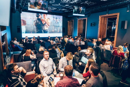 Saint Petersburg, Russia, 27 September 2019, Teams of people play quiz question competition in bar