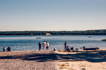 Saint Petersburg, Russia, 13 June 2020, People walk along the coast of the Baltic Sea