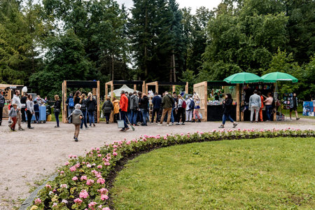 Saint Petersburg, Russia, 6 July 2019, People walk in the park and buy food in street stalls
