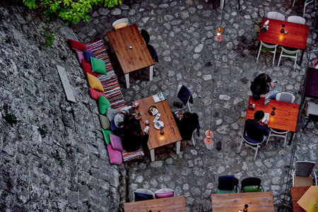 Bar, Montenegro, 27 April 2024, Coffee shop on outdoor terrace, people dining in restaurant on...