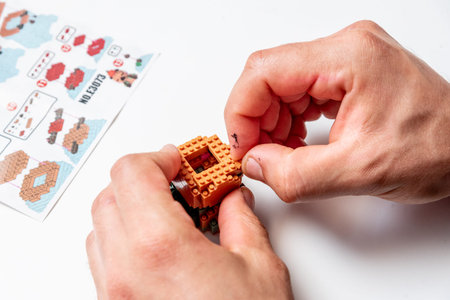 Bar, Montenegro, 20 March 2026, Man Generation X assembling constructor Lego figure animal capybara,...