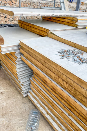 Stacks of fiber ecological mineral wool insulation stored at construction site building