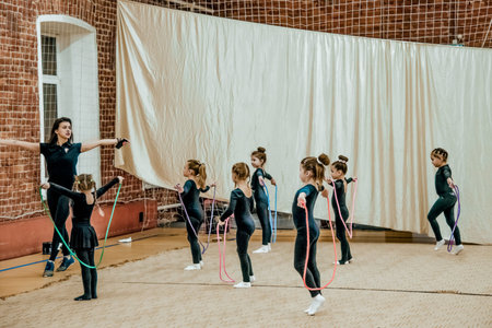 Saint Petersburg, Russia, 2 March 2020, Girls gymnasts engaged acrobatics exercise in gym