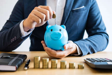 Coin stacks for step up growing business to profit and saving with piggy bank, Saving money for...