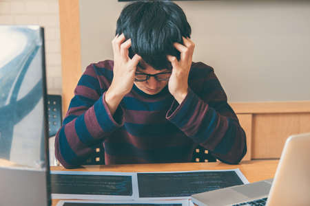Professional programmer working and stress in programming website a software and coding technology, writing codes and data code, Programming with HTML, PHP and javascript.の写真素材