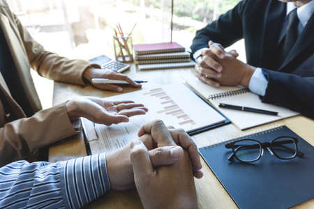 Startup business people group brainstorming on meeting to planning investment project working and strategy of business making conversation with partner, financial and accounting concept.の写真素材