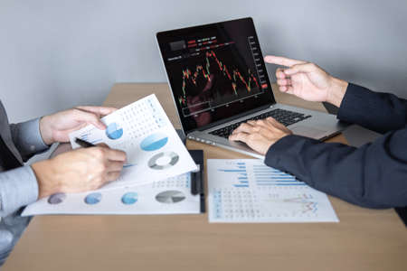Business team on meeting to planning investment trading project and strategy of deal on a stock...