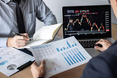 Business team discussion on meeting to planning investment trading project and strategy of deal on a stock exchange with partner, financial and accounting concept, collaborative teamwork.の写真素材