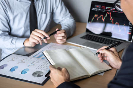 Business team on meeting to planning investment trading project and strategy of deal on a stock exchange with partner, financial and accounting concept, collaborative teamwork analyze data.の写真素材