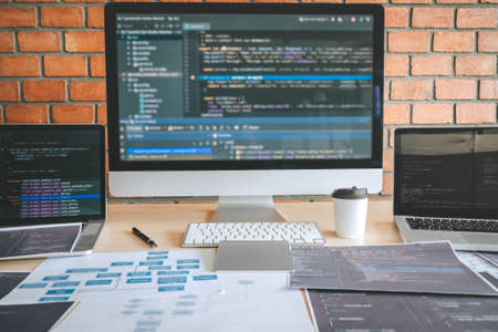 Tool of Professional Developer programmer working a software website design and coding technology, writing codes and database in company office, Global cyber connection technology.の写真素材