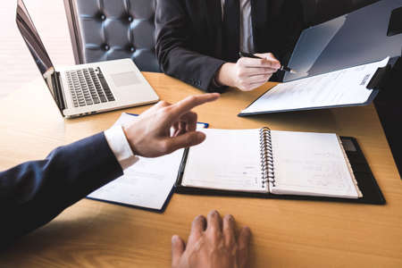 Employer arriving for a job interview, businessman listen to candidate answers explaining about his profile and colloquy dream job, manager sitting in job Interview talking in modern office.の写真素材