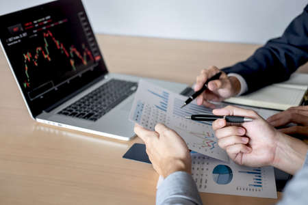 Business team discussion on meeting to planning investment trading project and strategy of deal on a stock exchange with partner, financial and accounting concept, collaborative teamwork.の写真素材