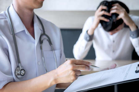 Doctor in white uniform gown coat and unhappy patient discussing consults explaining to treatment...