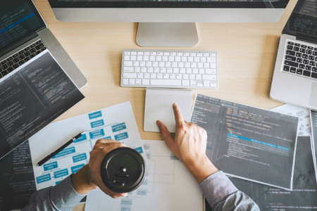 Professional Developer programmer working a software website design and coding technology, writing codes and database in company office, Global cyber connection technology.の写真素材