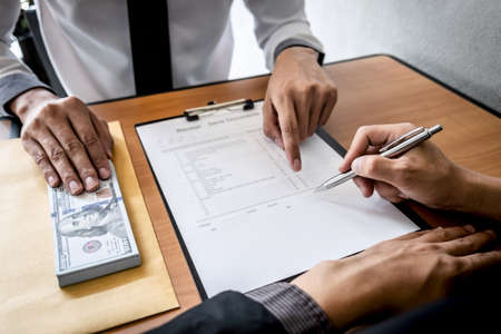 Dishonest cheating in business illegal money, Businessman giving bribe money in envelope to business...