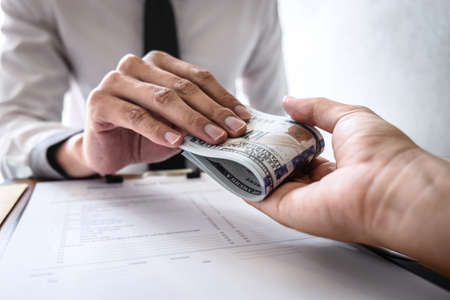 Dishonest cheating in business illegal money, Businessman receive bribe money to business people to...